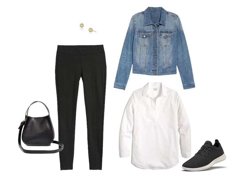 Black leggings with a white popover top, denim jacket, black sneakers, gold studs, and a black crossbody bag. 