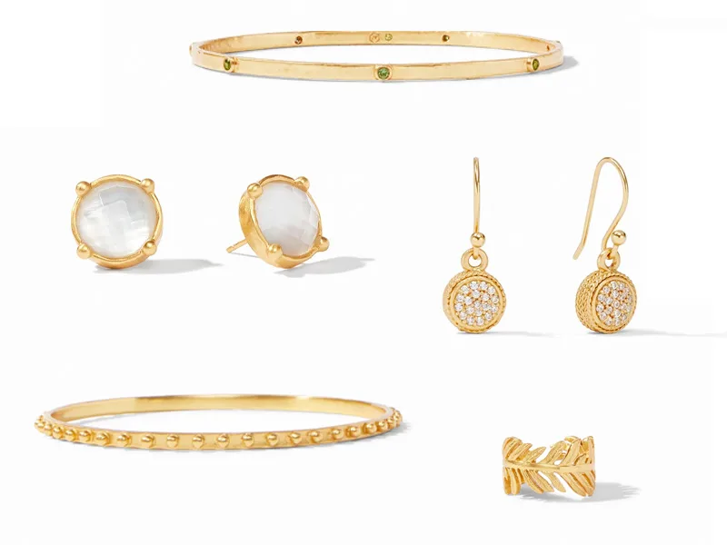 Gold jewelry from Julie Vos: two bangles, two earrings, and a reng