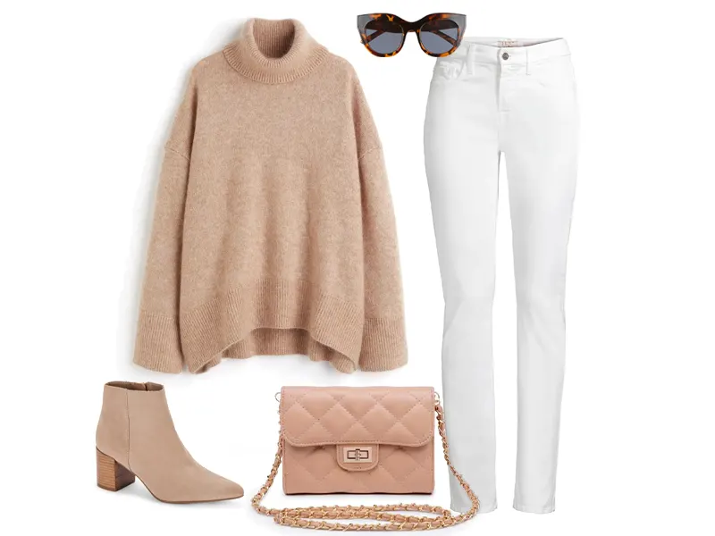 beige oversized sweater, tan booties, tan quilted crossbody, white straight jeans, and tortoise sunglasses