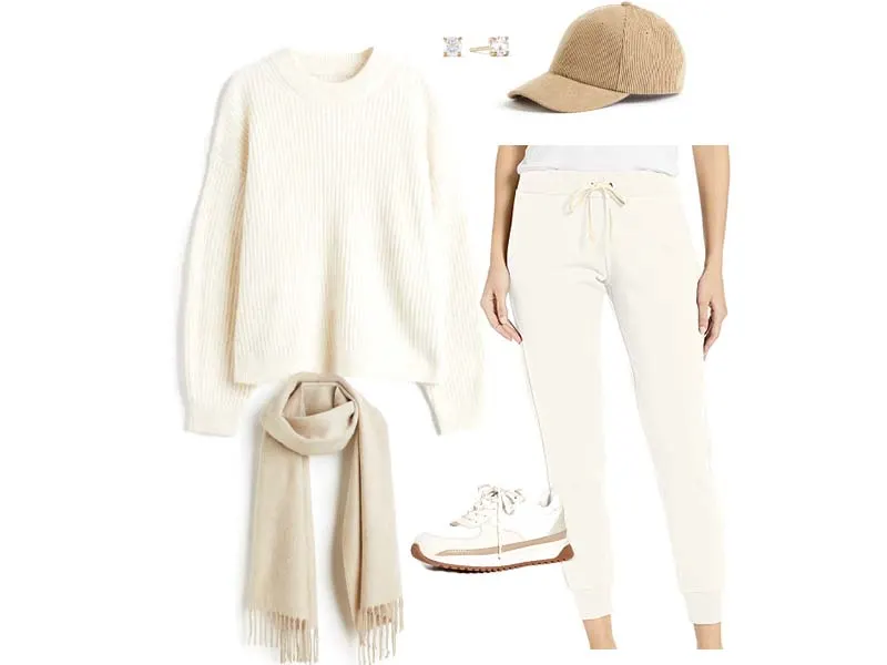 cream joggers, cream knit sweater, white sneakers, beige scarf, beige corduroy cap, and stud earrings 