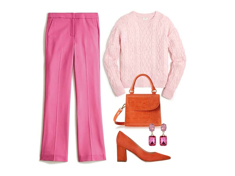 Pink wool pants with pink sweater, orange pumps, orange bag, and pink earrings