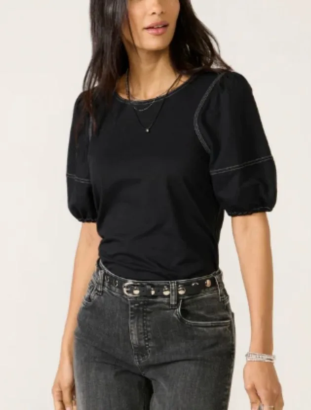 Black contrast stitch top styled with dark jeans, an elevated night out top for women over 40