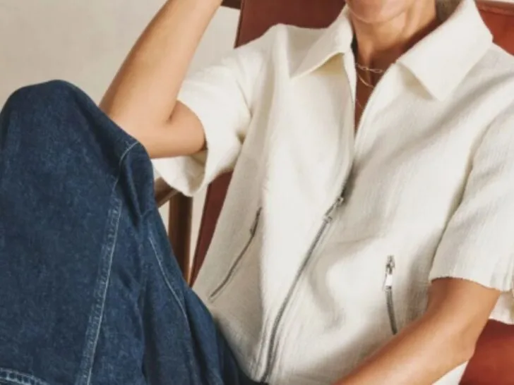 Modern white jacket styled with dark denim, polished casual style for women over 40