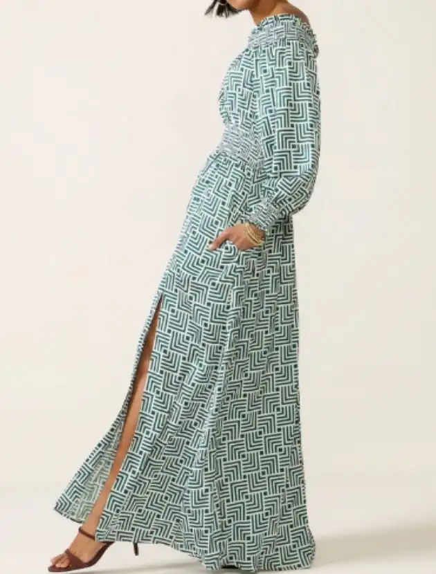 Green and white off the shoulder maxi dress styled for warm weather evenings, a vacation dinner dress for women over 40