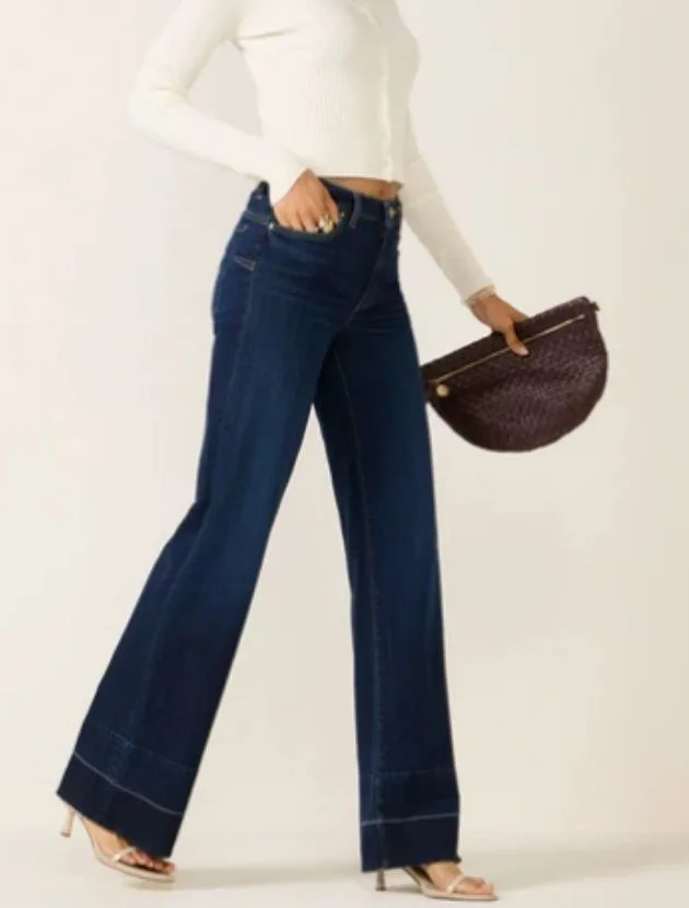 Dark wash wide leg jeans styled for women over 40, polished denim with a relaxed fit