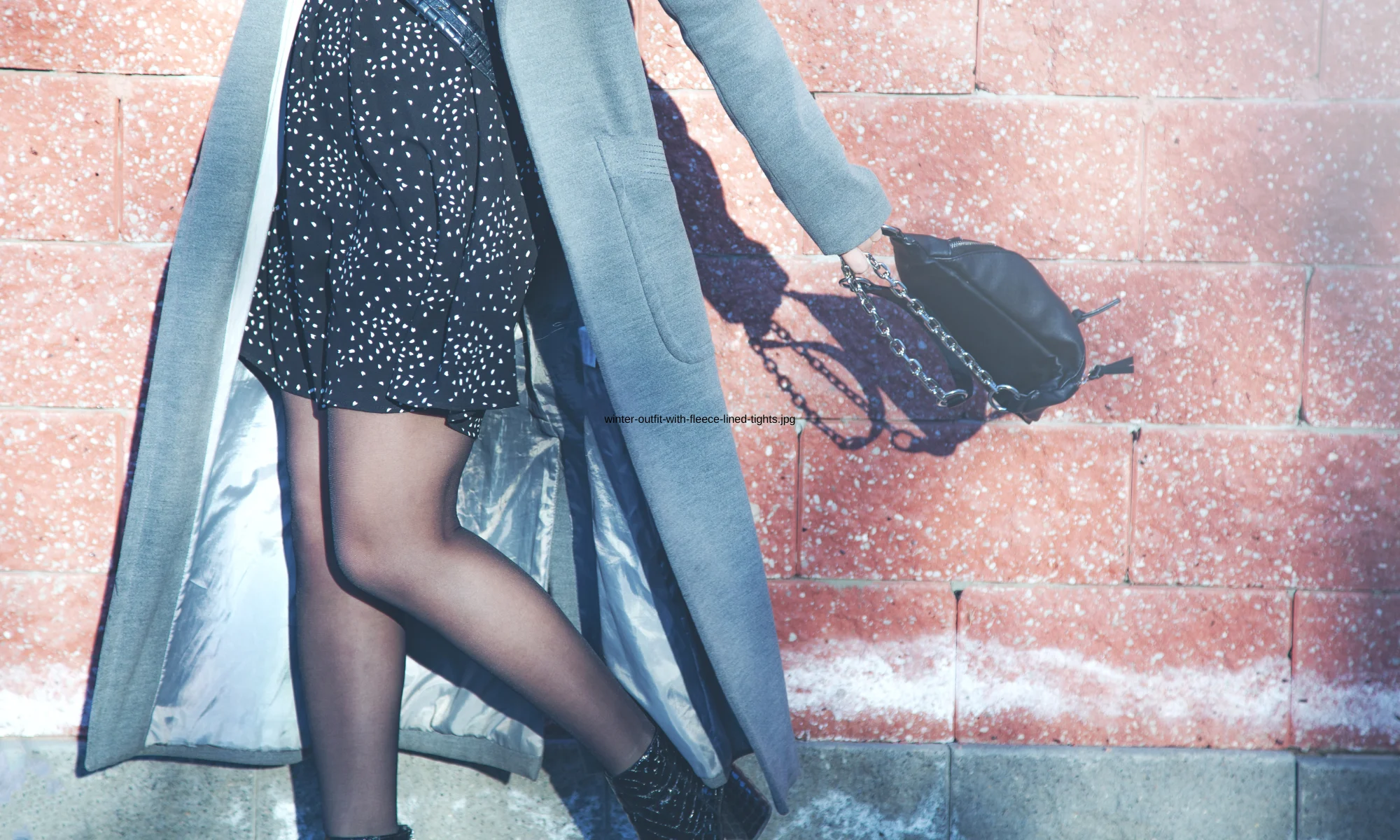 Sheer-look tights styled with a winter dress and coat, showing how fleece-lined tights fit into cold weather outfits.