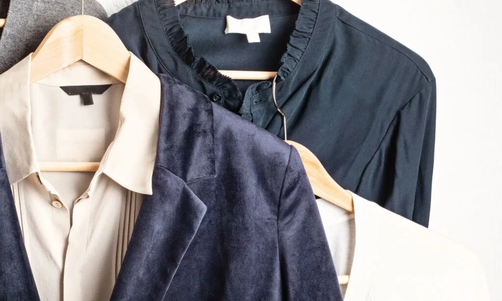 organized wardrobe with blazers and neutral basics illustrating how to shop your closet