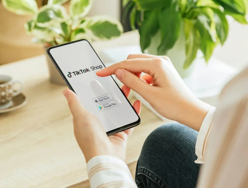 Person viewing TikTok Shop on a smartphone while browsing products
