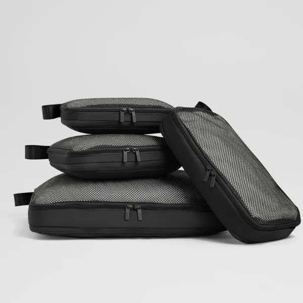 Away The Insider packing cubes stacked in black for organized carry-on travel