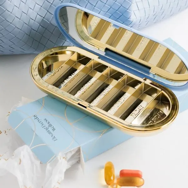 Dosey 7-day pill compact with labeled daily compartments for travel and carry-on organization