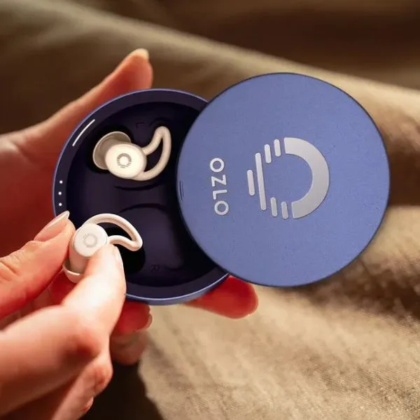 Ozlo noise-canceling sleepbuds in charging case for travel and carry-on packing