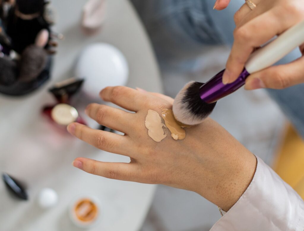 Applying liquid foundation with a pressing technique to avoid makeup pilling.