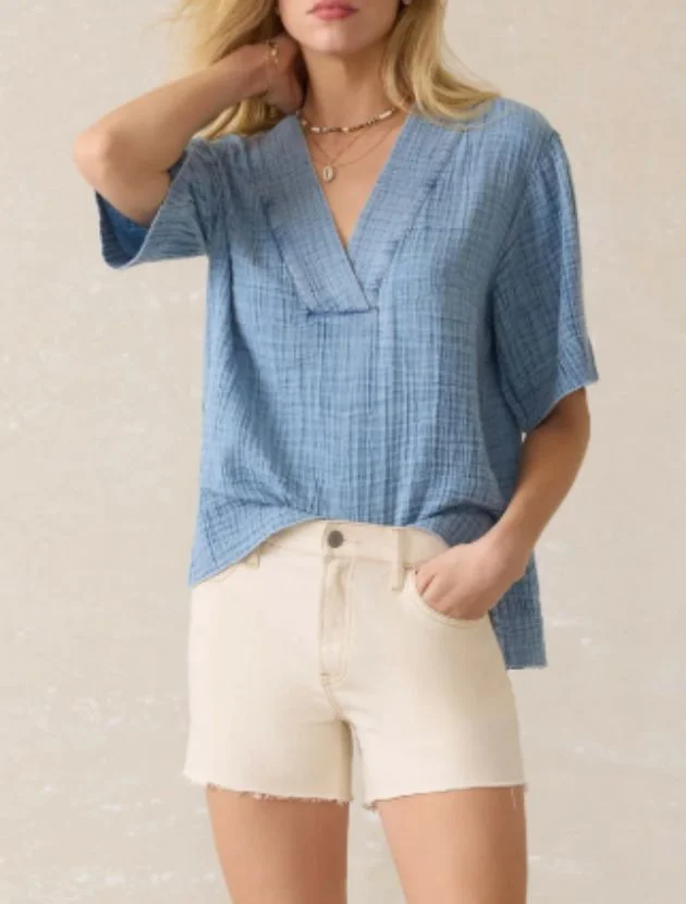 Faherty light indigo cotton gauze popover top styled for women over 40 with short sleeves and relaxed fit