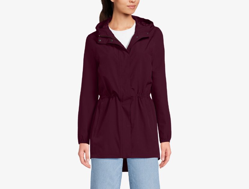 Woman wearing Lands’ End Squall Packable Waterproof Raincoat in burgundy, a lightweight waterproof fall jacket for women over 40