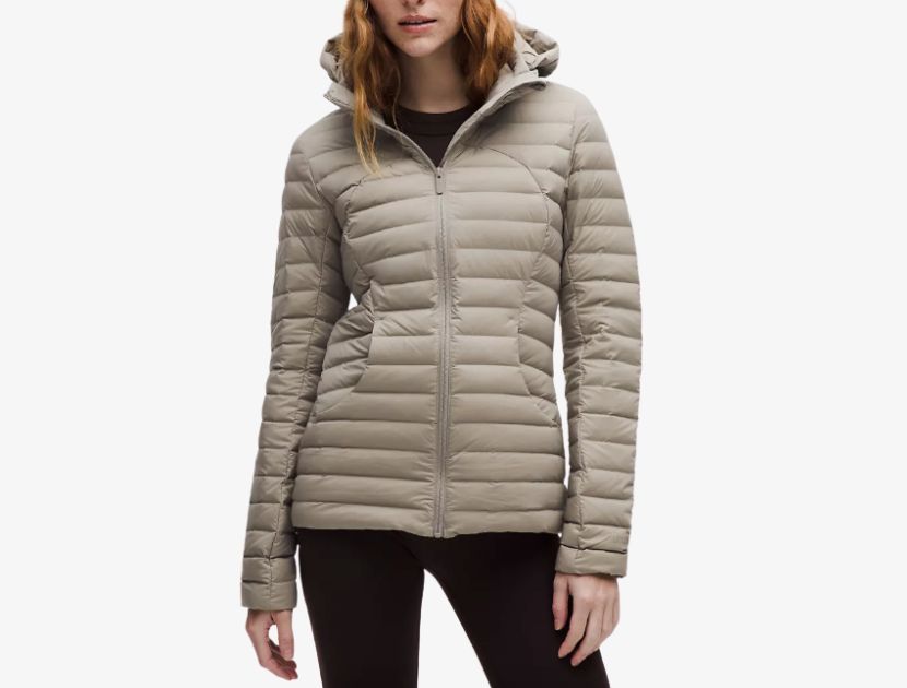 Woman wearing a slim-fit lightweight puffer jacket in warm ash grey, a practical fall outerwear option for women over 40.