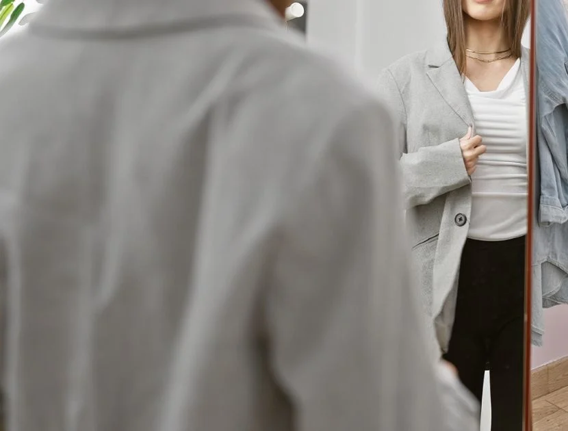 Trying on clothes during a closet clean-out
