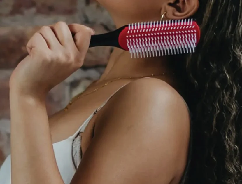 Brush designed for curly hair helping define texture while reducing frizz