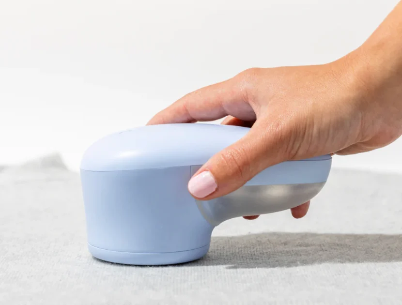 Using a fabric shaver to remove pilling from a sweater safely