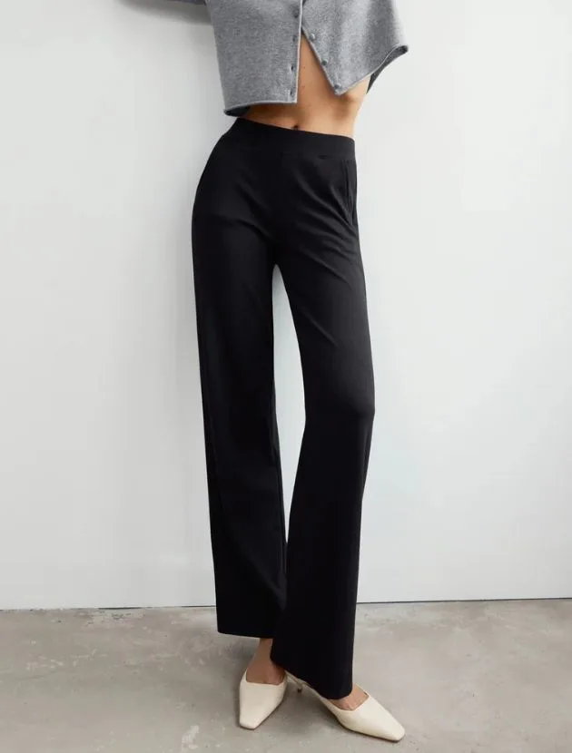 Black AYR High Hopes Pant styled with a cropped cardigan and heels, a polished pull-on pant for women over 40