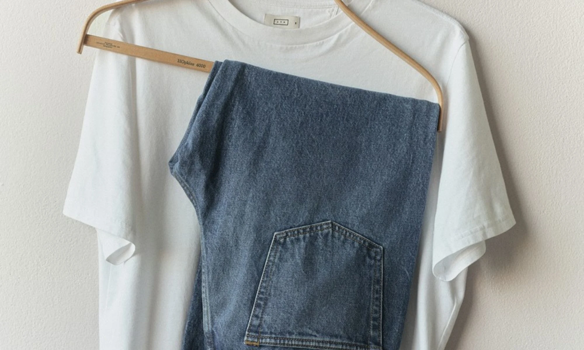 White AYR t-shirt styled with blue jeans, elevated everyday wardrobe essentials for women over 40