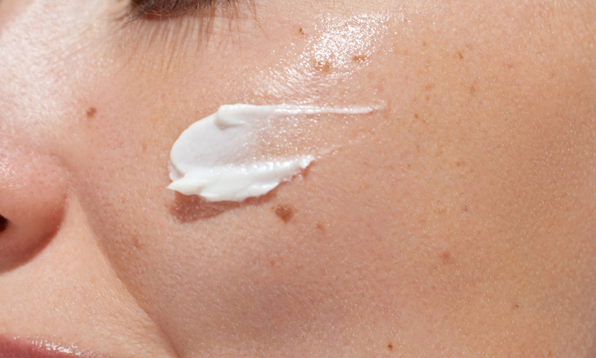 ceramide moisturizer applied to skin close up hydration barrier repair