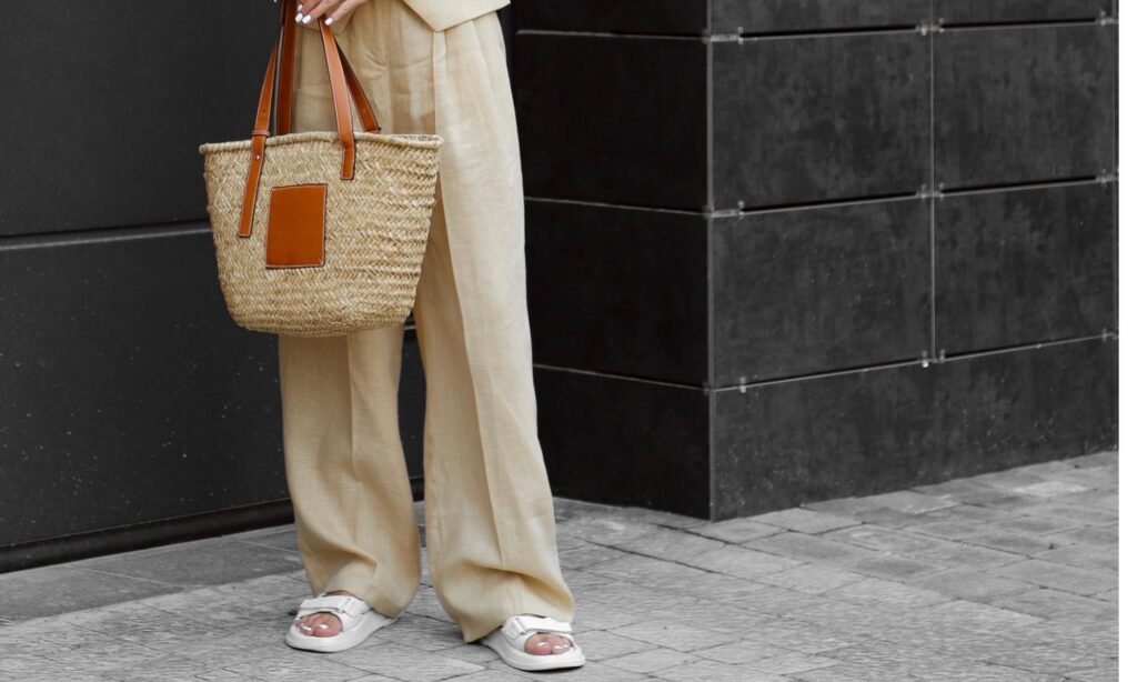 Wide leg linen pants styled with sandals and a basket bag