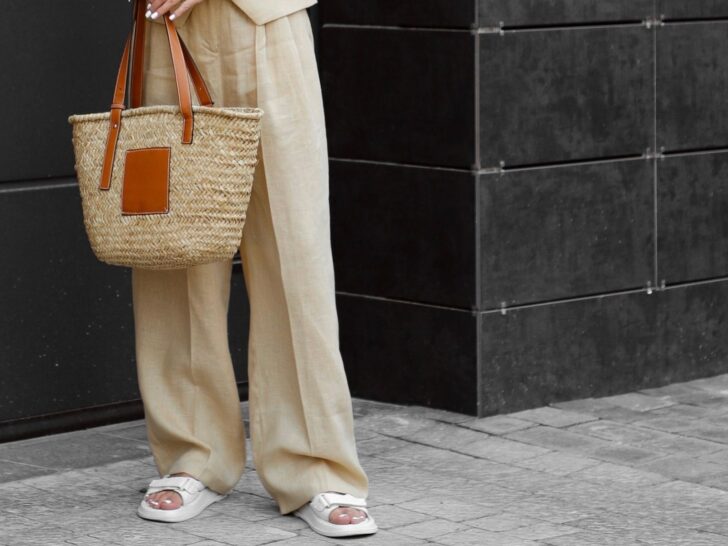 Wide leg linen pants styled with sandals and a basket bag