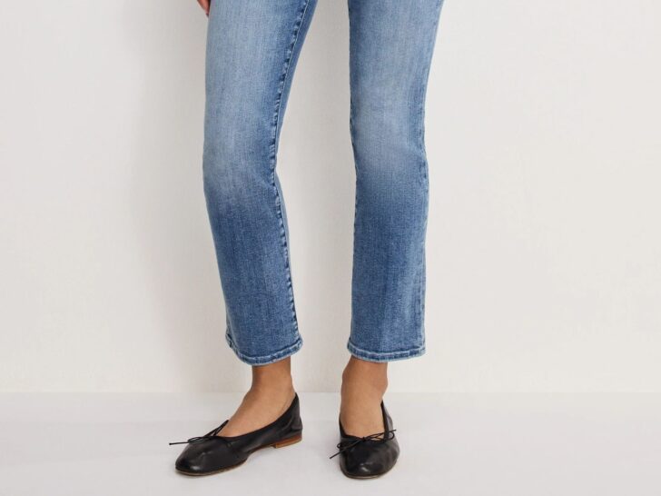 Straight leg ankle jeans in medium blue wash styled with black ballet flats