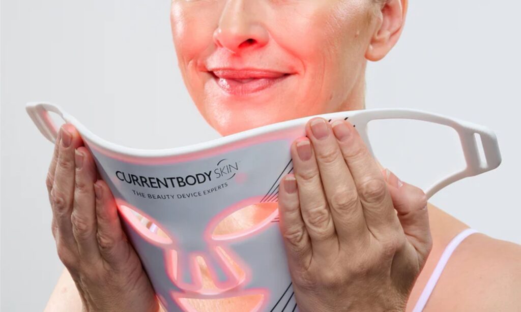 Woman holding CurrentBody LED mask Series 2