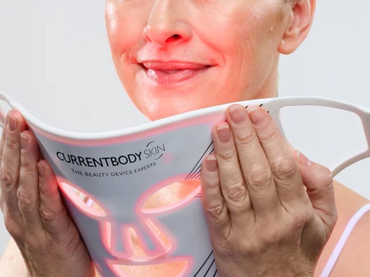 Woman holding CurrentBody LED mask Series 2