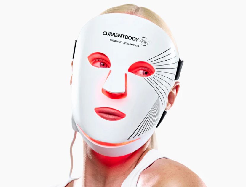 Woman wearing CurrentBody LED mask Series 2 with red light activated